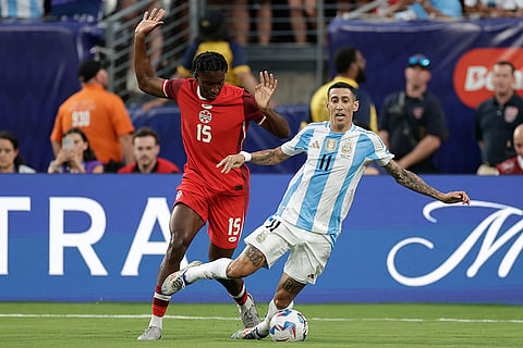 Moïse Bombito challenges Angel Di Maria